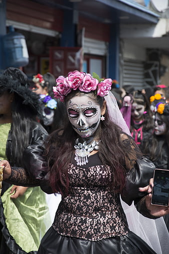 Young Woman in Catrina Makeup and Floral Headdress