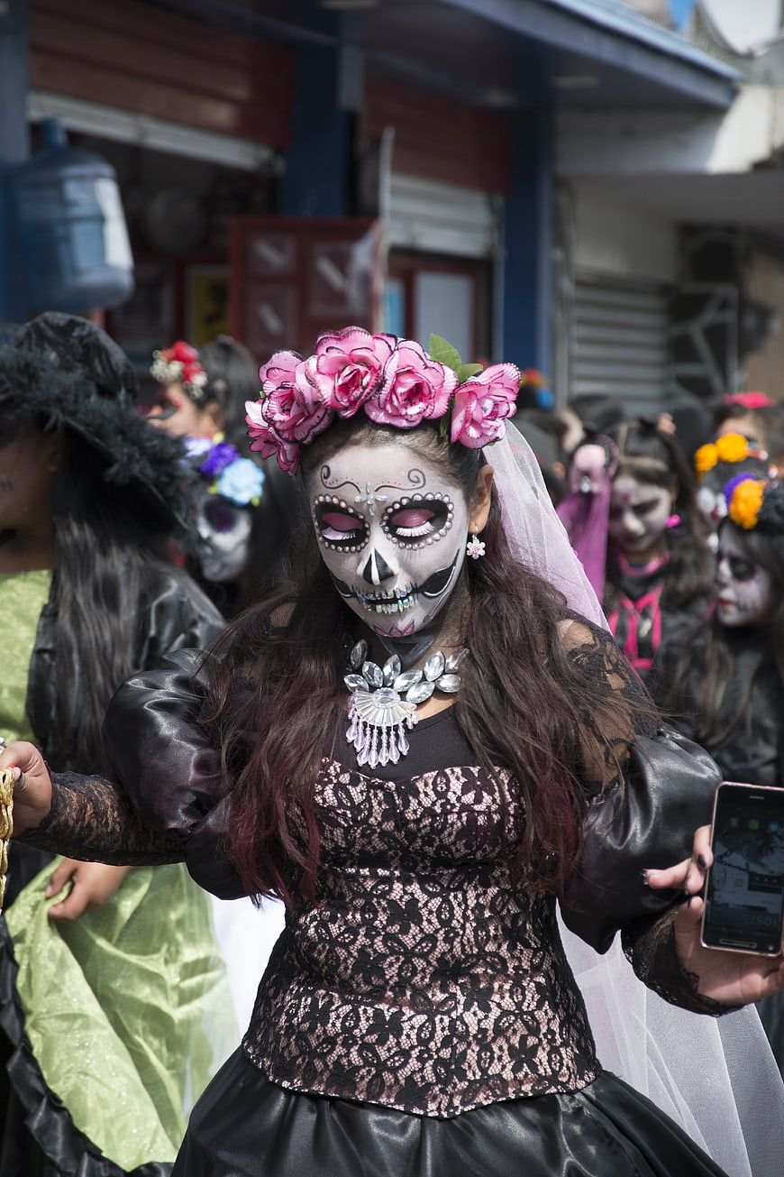 Young Woman in Catrina Makeup and Floral Headdress