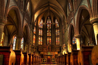 Interior of Gothic Cathedral with Stained Glass Windows and Altar