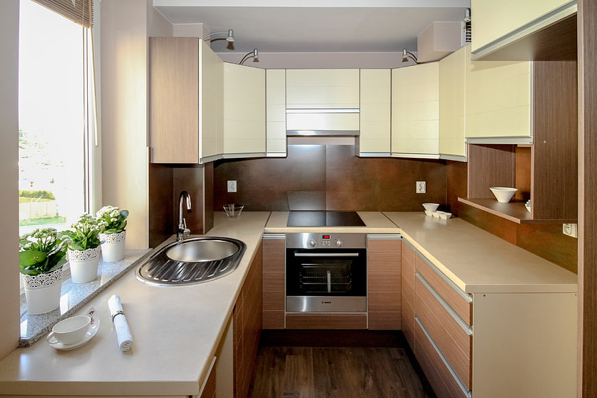 Modern U-Shaped Kitchen with Wooden Cabinets and Stainless Steel Appliances