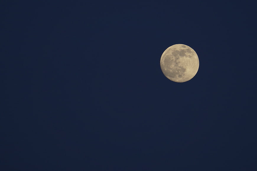 Full Moon Against Deep Blue Night Sky