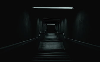 Dark atmospheric staircase with leading lines and moody lighting