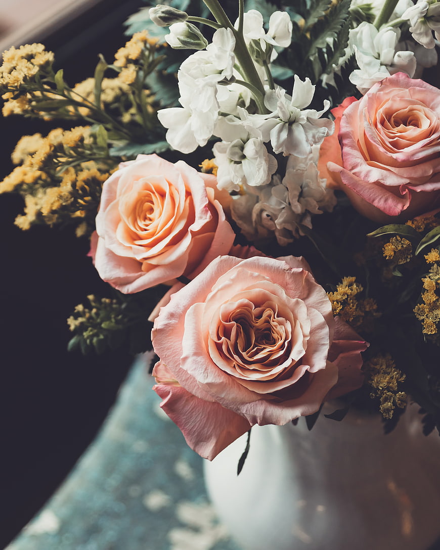 Close-up of Peach Roses and White Flowers in a Vase