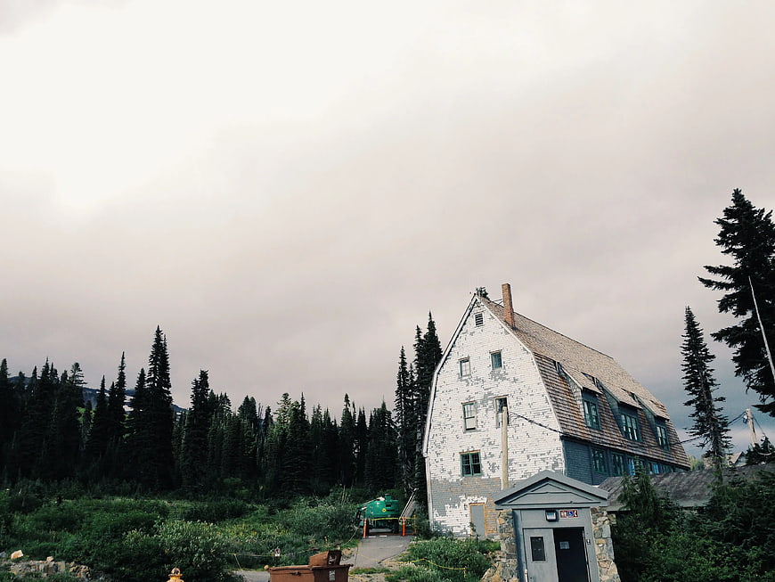Old White House with Peeling Paint in Forest