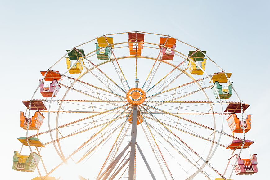 Colorful Ferris Wheel Against Bright Sky