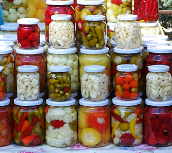 Colorful Jars of Pickled Vegetables and Preserves