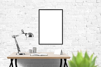 Minimalist white brick office desk with blank poster mockup