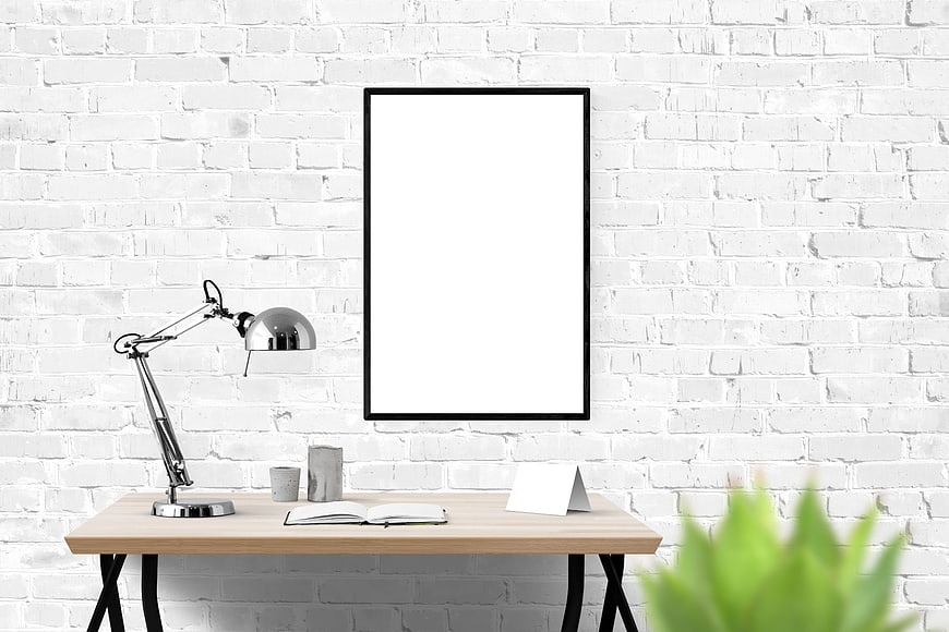 Minimalist white brick office desk with blank poster mockup