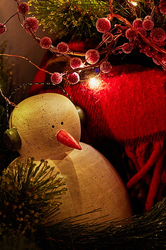Close-up of Wooden Snowman Ornament with Christmas Lights