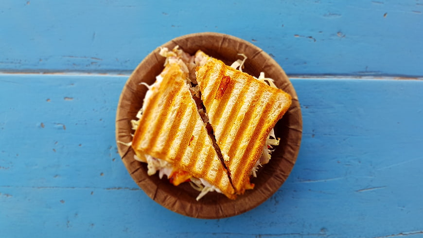 Grilled Panini Sandwich on Blue Wooden Background