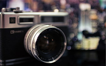 Close-up of vintage Yashica film camera with bokeh background