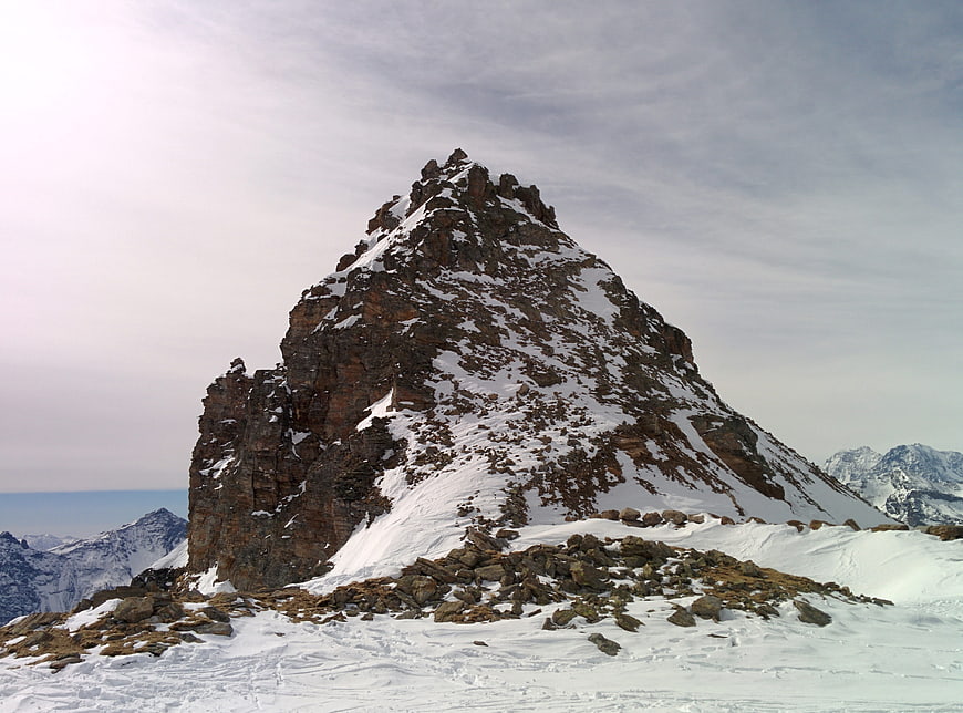 Snow-Covered Rocky Mountain Peak in Winter Landscape