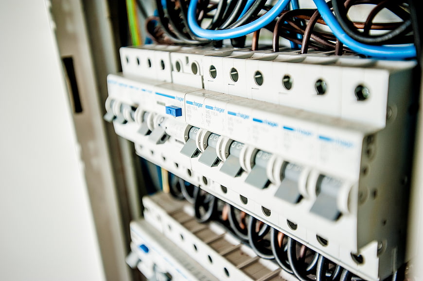 Close-up of electrical circuit breakers and wiring in a distribution box