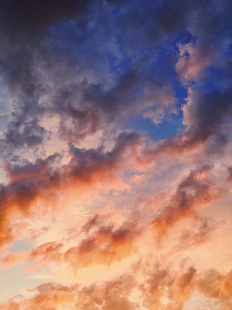 Dramatic sunset sky with vibrant orange and blue clouds