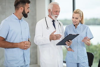 Medical Team Discussing Patient Records in Hospital
