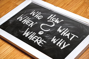 Chalkboard with question words who what where when why how