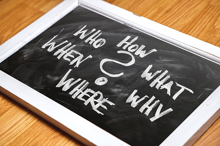 Chalkboard with question words who what where when why how