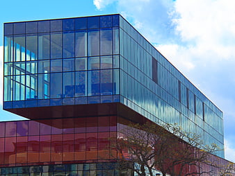 Modern Glass Office Building with Blue and Red Facade
