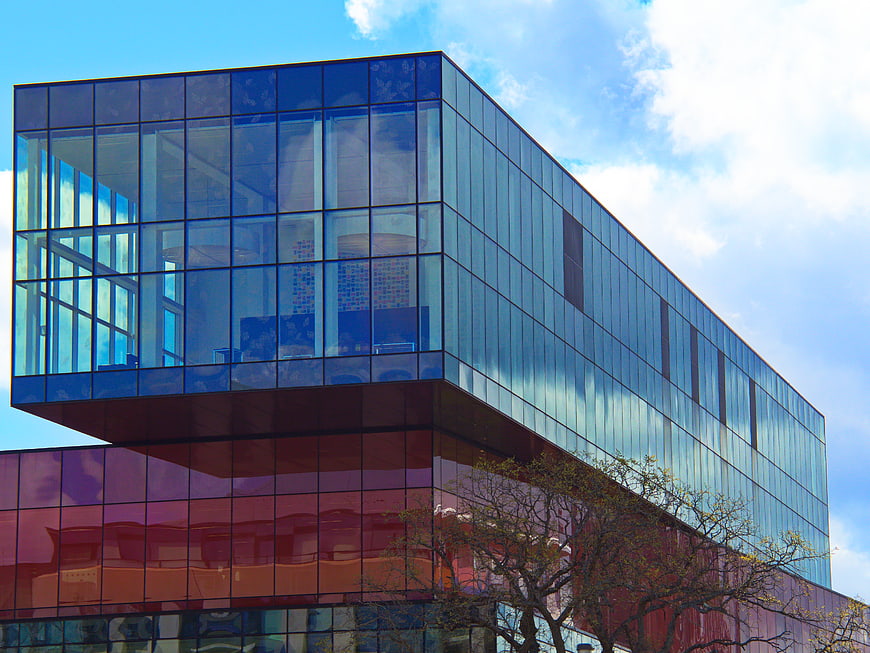 Modern Glass Office Building with Blue and Red Facade