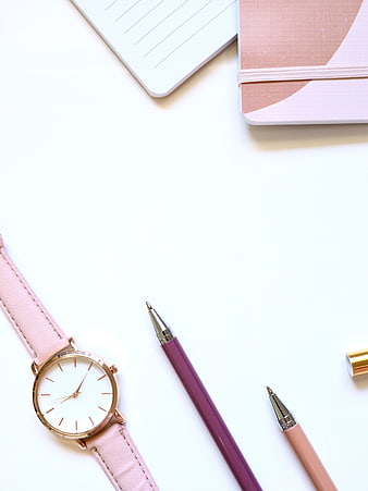 Minimalist Pink Flat Lay with Watch, Pens, and Notebook