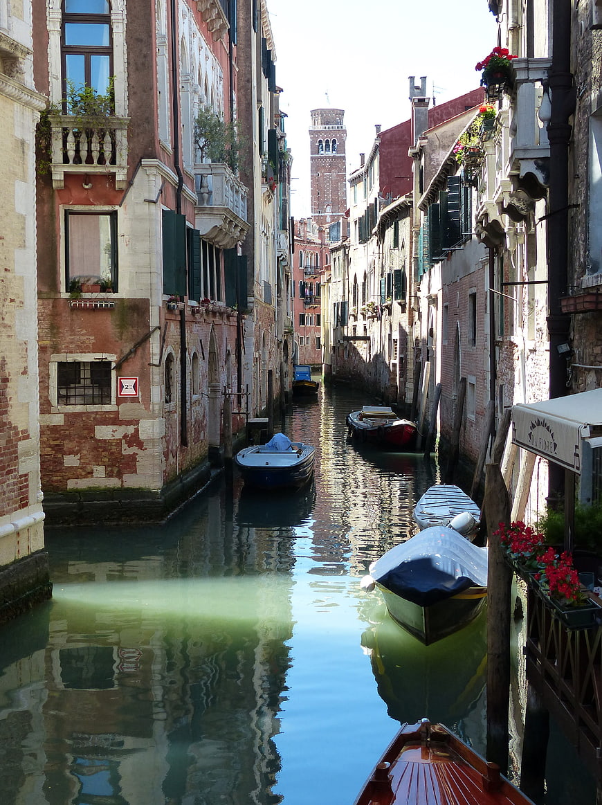 Venetian Canal with Moored Boats and Historic Architecture