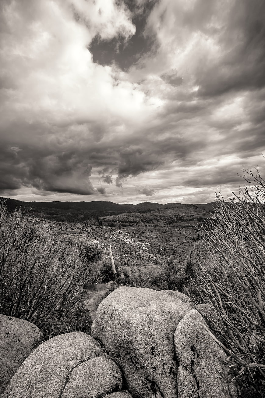 Dramatic Black and White Landscape with Boulders and Clouds