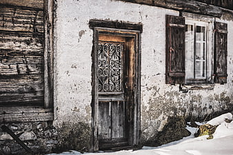 Weathered Rustic Farmhouse Door And Window In Winter Snow
