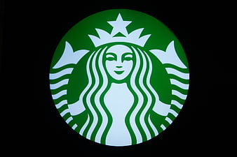 Illuminated Starbucks Logo on Black Background