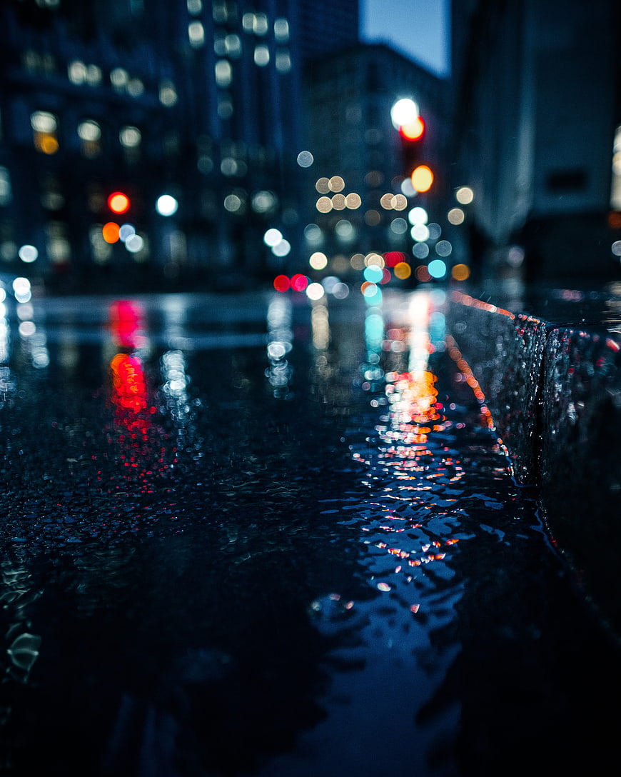 Wet City Street at Night with Bokeh Lights