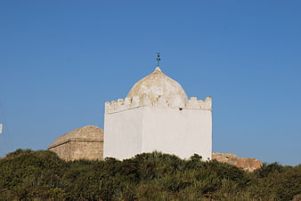 White domed tower in Essaouira, Morocco against blue sky
