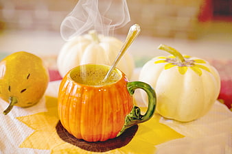 Steaming Pumpkin-Shaped Mug With Hot Coffee And Autumn Gourds