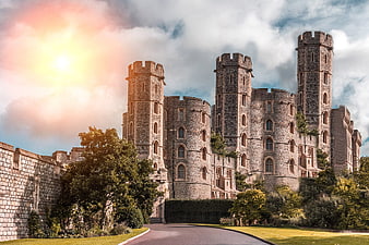 Historic Stone Castle with Towers and Dramatic Sky