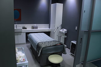 Modern dermatology clinic treatment room interior