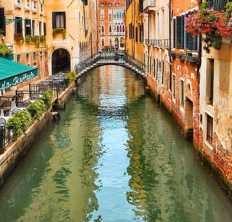 Venice Canal View With Historic Bridge And Colorful Buildings