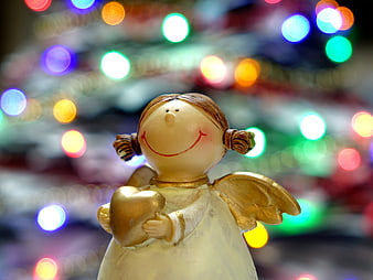 Ceramic Angel Figurine Holding Golden Heart with Christmas Lights