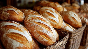 Freshly Baked Artisan Bread Loaves in Wicker Baskets