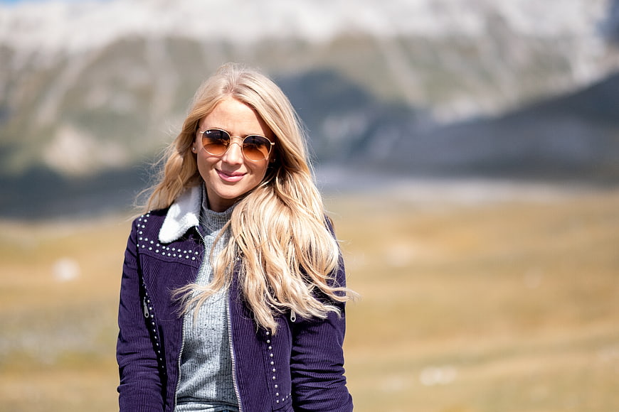 Portrait of Happy Blonde Woman in Sunglasses Outdoors