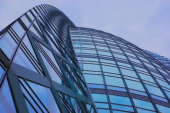 Low-angle view of modern glass skyscraper architecture