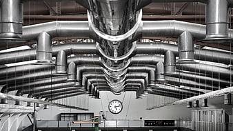 Symmetrical industrial ventilation ducts in a factory hall