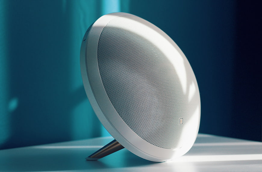 Modern white round speaker on minimalist table with blue background