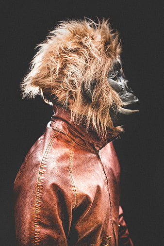 Person in Lion Mask and Leather Jacket Profile