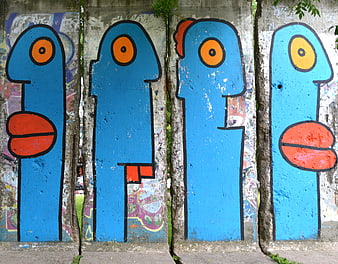 Blue Abstract Graffiti Figures on Concrete Wall