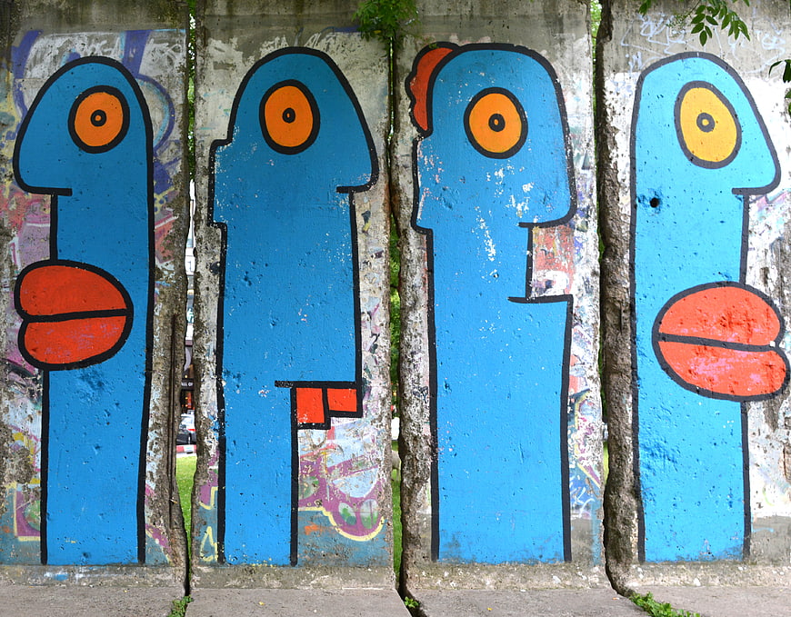 Blue Abstract Graffiti Figures on Concrete Wall