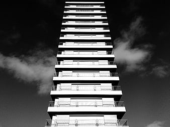 Black and white low angle view of modern high-rise building