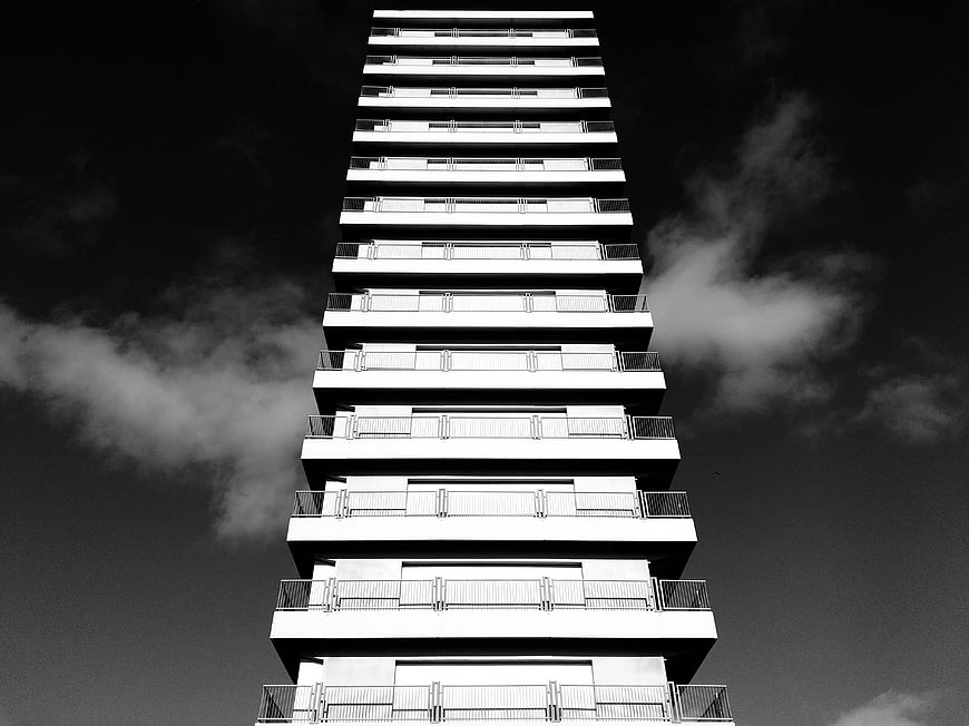 Black and white low angle view of modern high-rise building