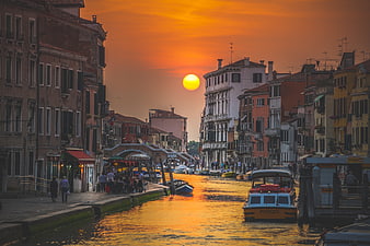 Venice Canal Sunset with Water Taxi and Historic Buildings