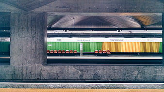 Empty Vila Mariana subway station platform with colorful wall
