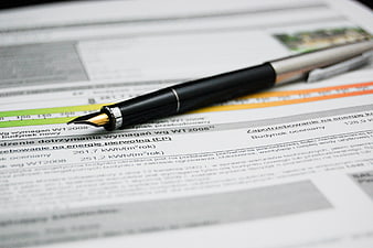 Fountain pen on energy efficiency certificate document