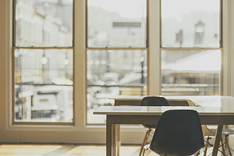 Modern office workspace with large windows and city view