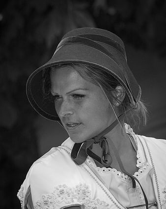 Black and white portrait of woman in traditional hat
